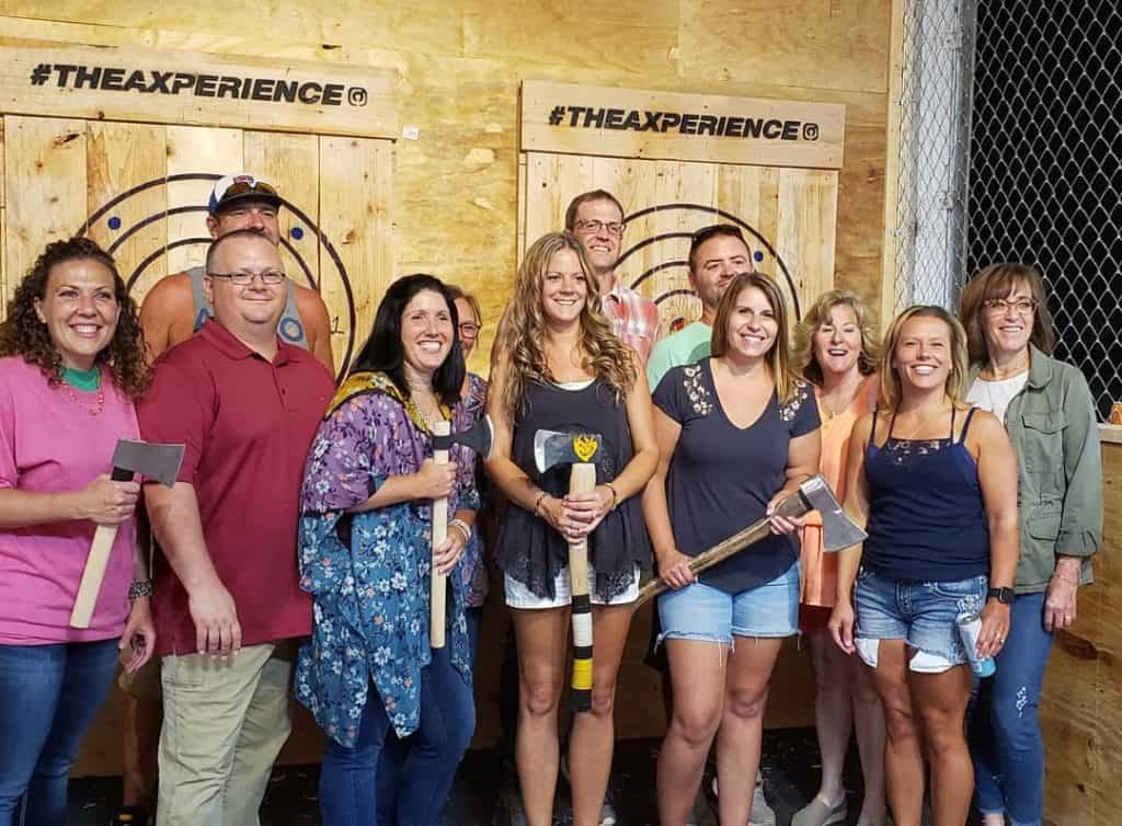 family event at an indoor axe throwing arena